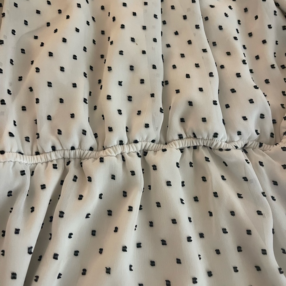 Sleeveless white and black dot dress